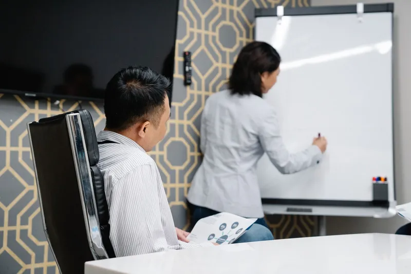 A team of employees discussing strategy in a conference room