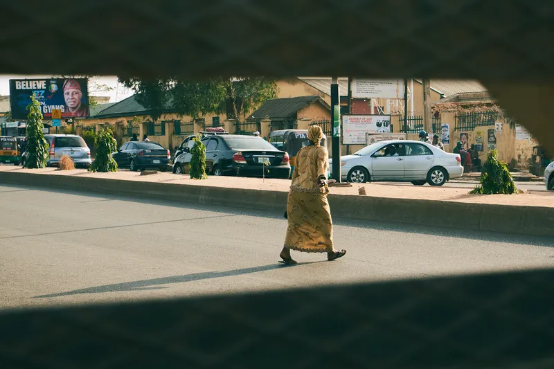 A street scene in Jos, Plateau State, with local pedestrians and traffic
