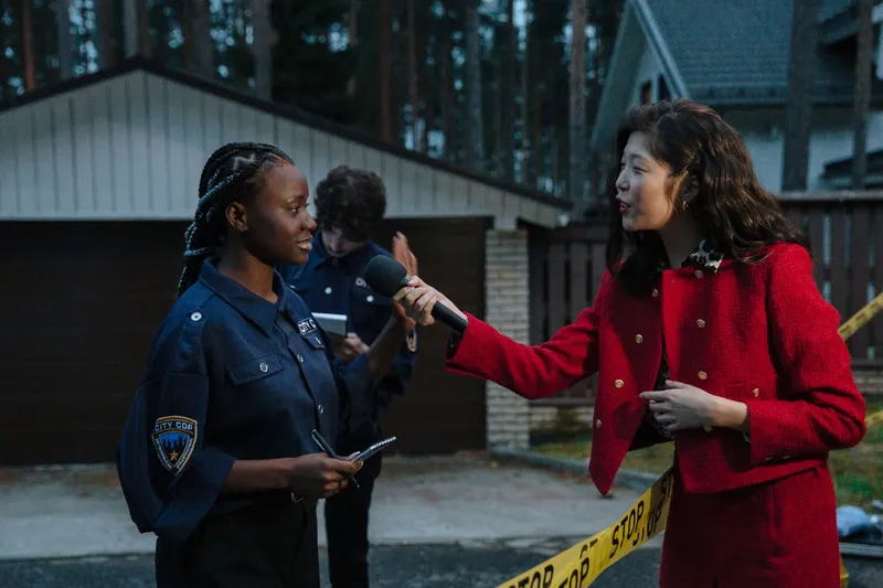 A journalist conducting an interview on location for a news report